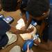Cass Tech freshman practice compressions as they use a defibrillator during a tour o f the Clinical Simulation Center at University of Michigan Hospital on Thursday, Jan. 10. Melanie Maxwell I AnnArbor.com